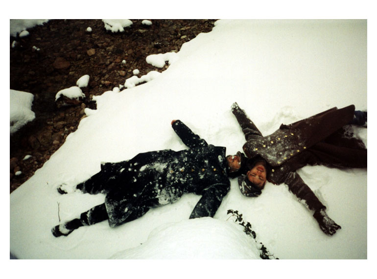 antiwar Ukrainian art, dead young soldiers lie on snow, artistic photograph